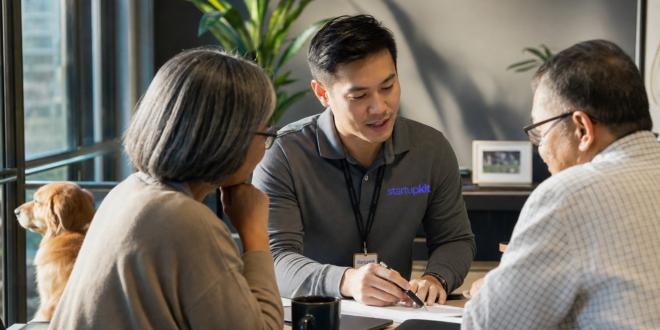 A financial advisor reviewing a retirement plan with an older couple across a desk in a sunlit office during a client hiring consultation